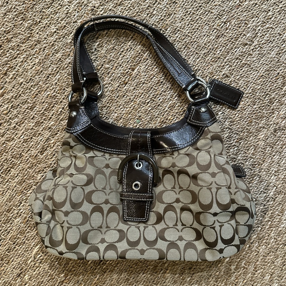 Coach brown vintage purse. Has Coach tag, 2 openings w inside pockets. Pristine